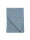 A neatly folded, dusty blue linen horse stable sheet featuring a fine-ribbed textured weave.