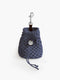A dark slate blue macramé knotted rope poop bag holder from Manifattura VALOR featuring matching drawstring ties, a silver-tone swivel snap hook, and a circular silver monogram charm.