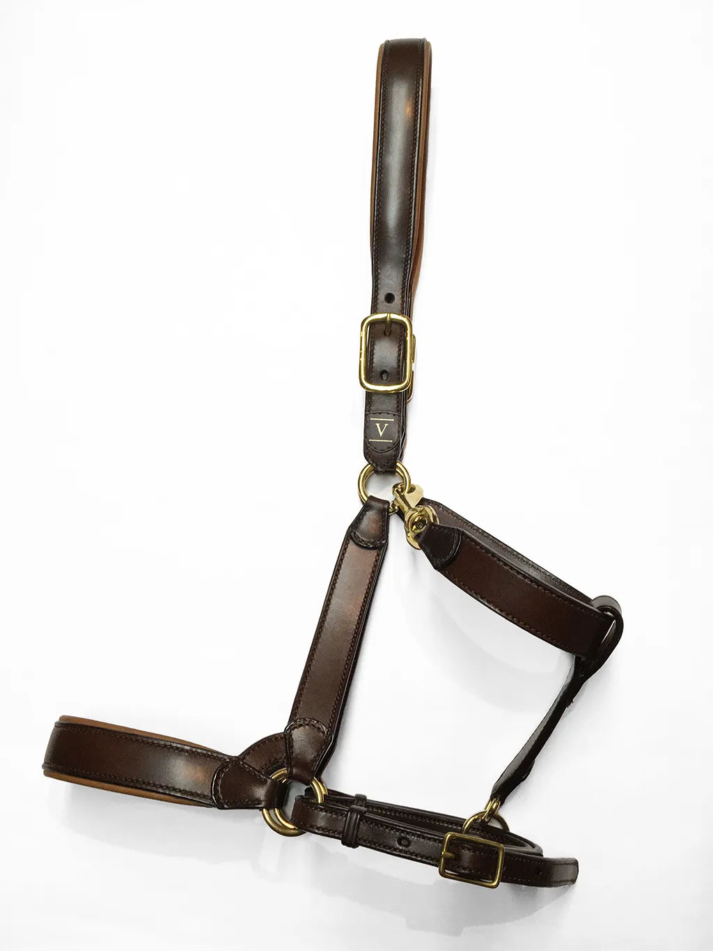 A premium dark brown leather horse halter with anatomical padding and gold-tone brass hardware.