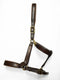 A premium dark brown leather horse halter with anatomical padding and gold-tone brass hardware.