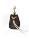 A dark espresso brown leather bucket-bag-style poop bag holder from Manifattura VALOR featuring cream drawstring cords, a brass swivel snap hook, and an embossed V logo.