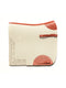 A side-view image of a cream felt horse saddle pad with bright orange leather trim, wear leathers, and a girth strap, featuring a laser-cut herringbone border on the back half, isolated on a white background.