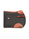 A side-view image of a dark charcoal felt horse saddle pad with bright orange leather trim, wear leathers, and a girth strap, featuring a laser-cut herringbone border on the back half, isolated on a white background.