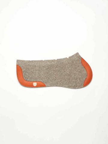 Grey felt half saddle pad with orange trim, curved shape, and contoured ergonomic design.