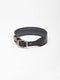 A wide black leather dog collar from Manifattura VALOR featuring silver hardware, a roller buckle, and a subtly embossed V shield monogram logo.