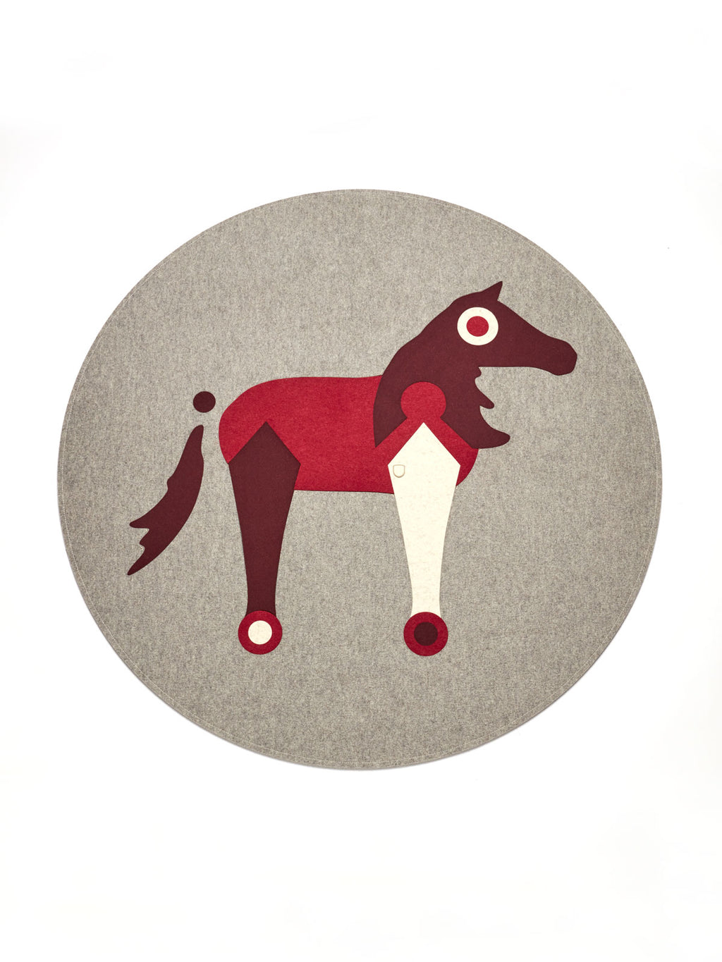 Decorative geometric horse design in red, brown, and cream on a round gray felt mat for equestrian decor.
