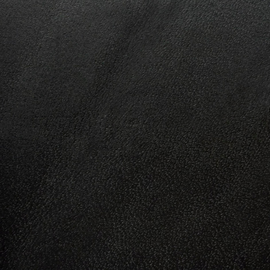 Close-up of dark black leather with a textured finish used for high-quality dog collars.